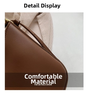 Detailed macro view of brown leather texture and adjustable shoulder strap buckle