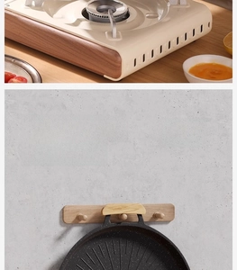 Detail showing portable cream stove with wood trim and hanging non-stick grill pan