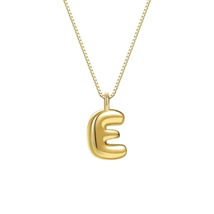 Gold bubble letter E pendant necklace with polished metal finish on a box chain for women