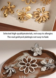 Close-up of gold and silver flower brooches with PVD plating and pearl details