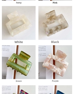 Macro display of large square acetate hair claws in various vintage marble patterns