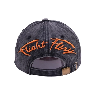 Detail of Fight Fury embroidery and metal buckle on washed cotton baseball cap