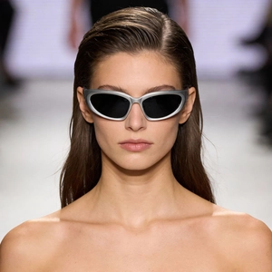Y2K silver wrap-around sunglasses with sleek black lenses and futuristic cat-eye frame