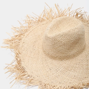 French style raffia sun hat with wide frayed edges and classic crown for beach vacation