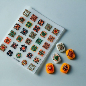 Macro detail of 5D embossed nail stickers featuring colorful bohemian geometric patterns