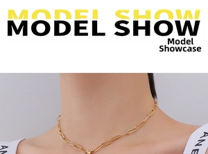 Close-up of minimalist gold star pendant necklace on model with paperclip chain