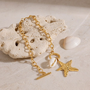 Gold stainless steel starfish and shell bracelet with toggle clasp on coral stone