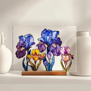 Close-up of a colorful 3D acrylic flower display with a solid natural wooden base