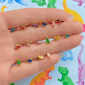 Colorful dinosaur stud earrings set with vibrant cubic zirconia in gold plating