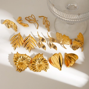 Minimalist gold stainless steel leaf earrings collection with various botanical designs