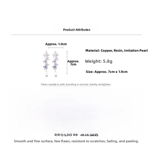 Detail view of floral tassel earrings showing resin flowers and pearl drop with dimensions