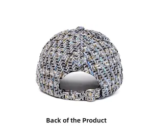 Macro view of multi-color tweed baseball cap showing metal buckle and woven texture