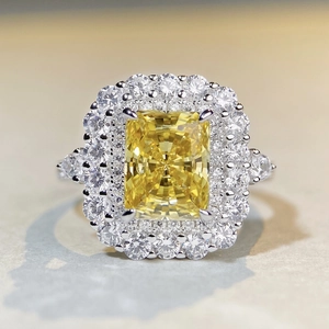 Luxurious S925 silver ring featuring a large radiant cut yellow diamond with halo pavé diamonds