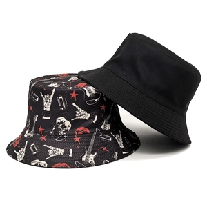 Double-sided bucket hat featuring rock and roll guitar prints and a minimalist black design
