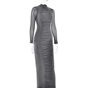 Close-up of ruched high-neck dress with sheer mesh long sleeves on a mannequin