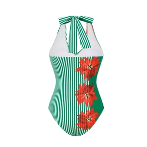 Detail of green leaf print swimsuit with striped bow and bright floral accents