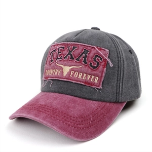 Close-up of vintage Texas embroidery and distressed patch on washed baseball cap