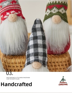 Close-up of hand-stitched Christmas gnomes with knitted hats and white faux fur beards