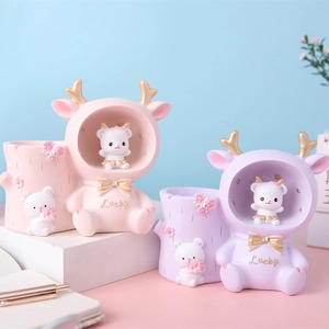 Pink and purple deer pen holder with night light and lucky bear figurines for desk