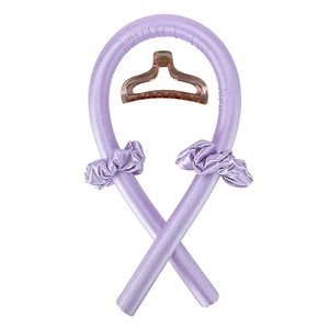 Detail view of lavender satin heatless hair curler set with matching scrunchies and clear clip