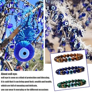 Detail of beaded evil eye bracelets with golden crown accents and natural tiger eye stones