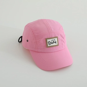 Detailed view of the pink breathable outdoor cap featuring a BEAR and bear head patch