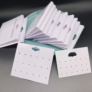 White PVC earring display cards with multiple holes for stud and hook jewelry organization