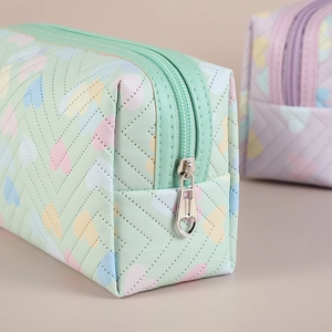 Mint green quilted heart pattern makeup bag in PU leather with heart-shaped zipper puller