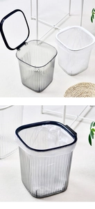 Detailed view of luxury striped transparent trash cans in black and white styles