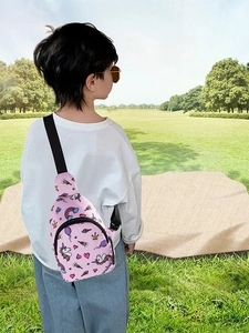 Rear view of a child wearing a pink unicorn crossbody bag showing adjustable straps