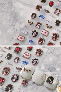 Detail of 3D embossed nail stickers featuring vintage roses and swan oil painting patterns