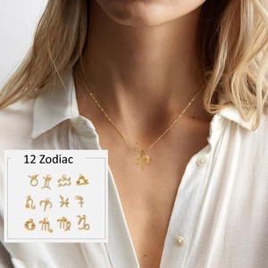 Model wearing gold 12 Zodiac necklace with micro-inlaid rhinestones fashion detail