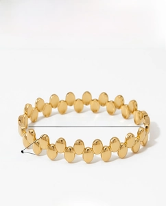 Polished gold stainless steel bangle detail with dimensions 61mm inner diameter and 12mm height