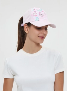 Pink baseball cap with butterfly pattern and curved brim worn by a woman outdoors