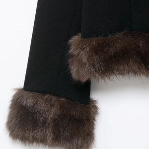 Women's black short jacket with stylish brown faux fur trim on cuffs and V-neckline