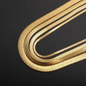 Set of four polished gold herringbone snake chains in varying widths for a layered look