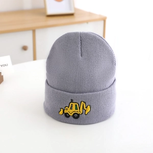 Close-up of yellow excavator embroidery on gray knit winter hat for boys and kids