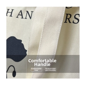 Close-up of durable reinforced handle and floral print on large canvas tote bag
