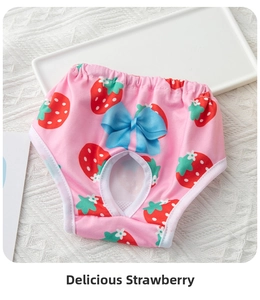Pink dog sanitary pants with strawberry print and blue bow detail on white texture