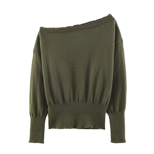 Detail view of ribbed hem and cuffs on off-shoulder long sleeve knitted sweater in olive green