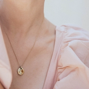 Gold-plated irregular kaleidoscope zircon necklace on model with minimalist style