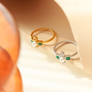 French luxury gold plated titanium ring with pearl and green gemstones in spiral band