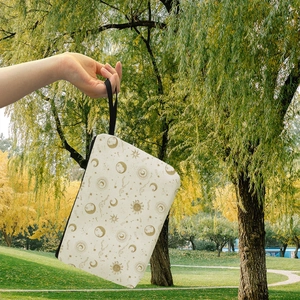 Celestial sun and moon pattern makeup bag with zipper closure and wrist strap