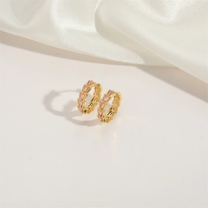 Gold-plated hoop earrings with pink rectangular zircon stones and scale geometric texture
