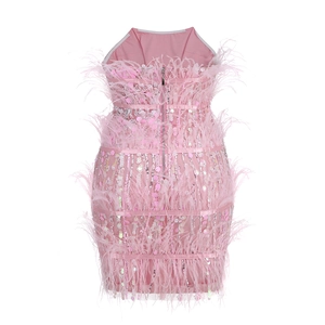 Detail of pink sequin cocktail dress featuring premium ostrich feather trim and back zipper