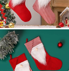 Detailed view of red striped Christmas gnome stockings with white faux fur trim and beard