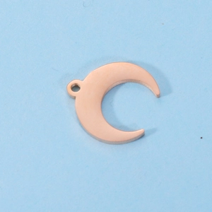 Detailed view of a rose gold crescent moon pendant charm for DIY jewelry making