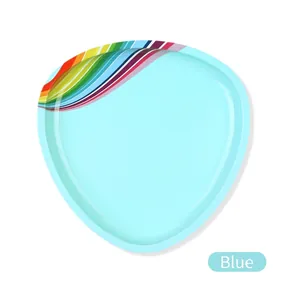 Macro shot of light blue triangular stainless steel tray with colorful rainbow stripe edge