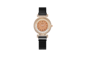 Close-up of rose gold watch face with floating crystals and black Milanese strap