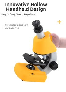 Detailed view of yellow portable children's microscope with hollow handle and focus knobs